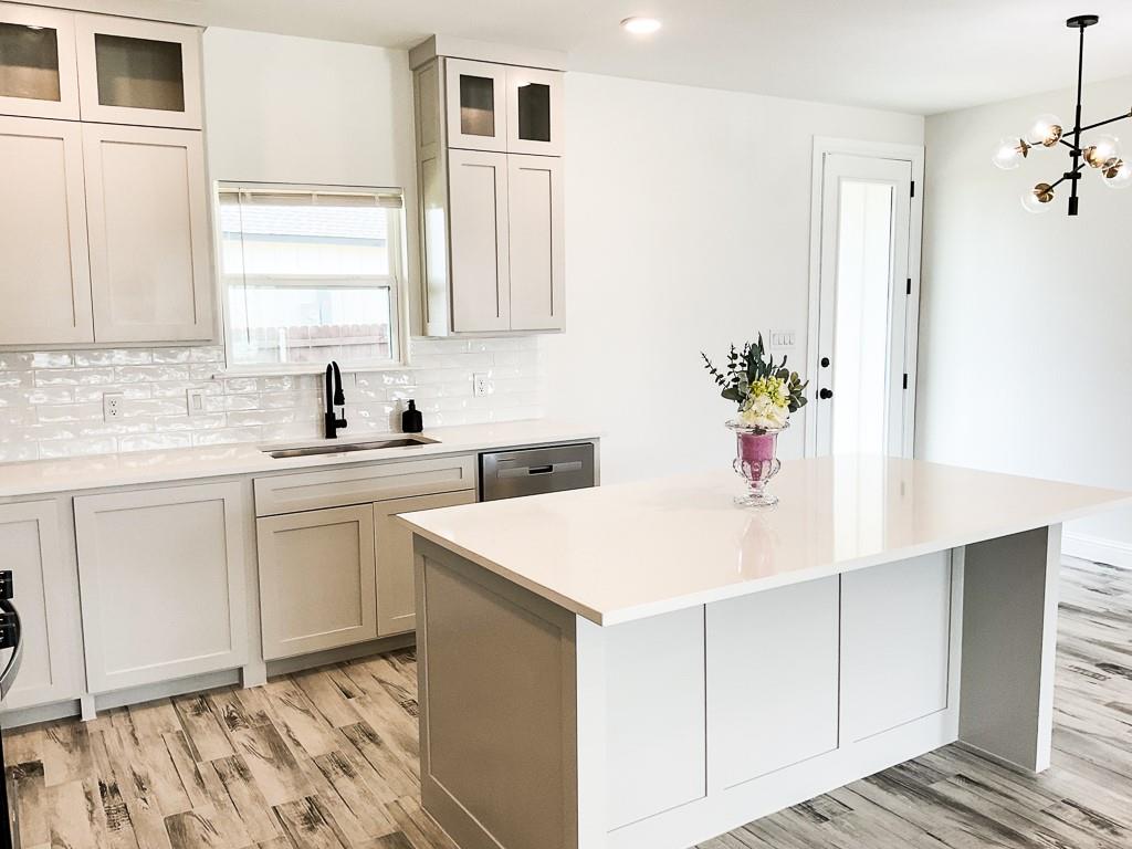201 Bluff Court Godley, TX 76044 - Photo 5 of 17 a kitchen with a sink cabinets and window