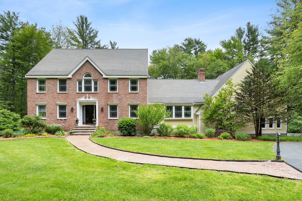 1173 North Road Carlisle, MA 01741 - Photo 1 of 1 a front view of a house with a yard