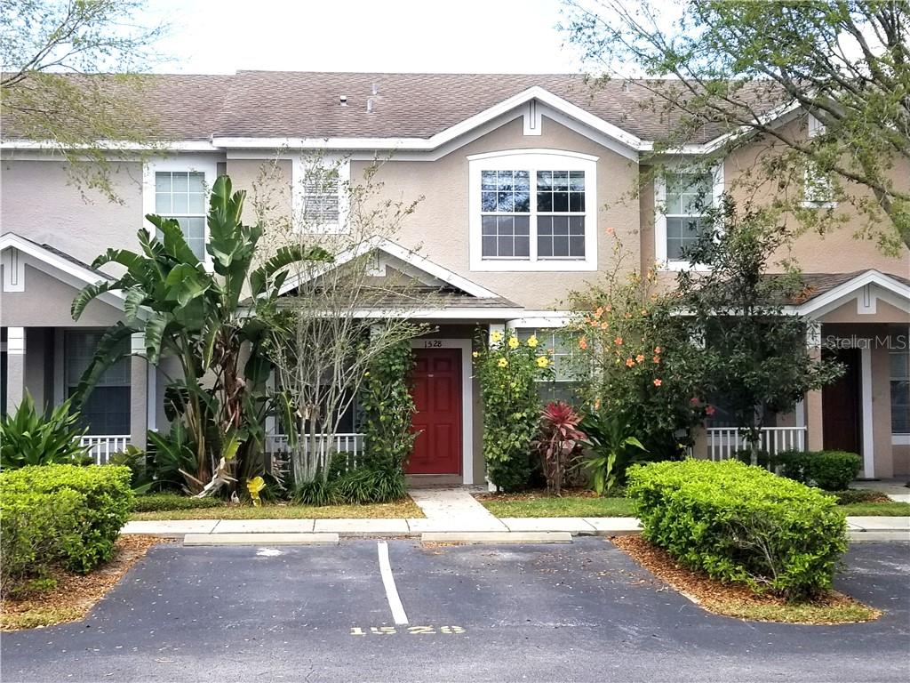 1528 Blue Magnolia Road, Unit 1528 Brandon, FL 33510 - Photo 1 of 1 a front view of a house with a yard