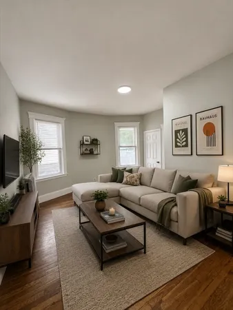 a living room with furniture flat screen tv and window