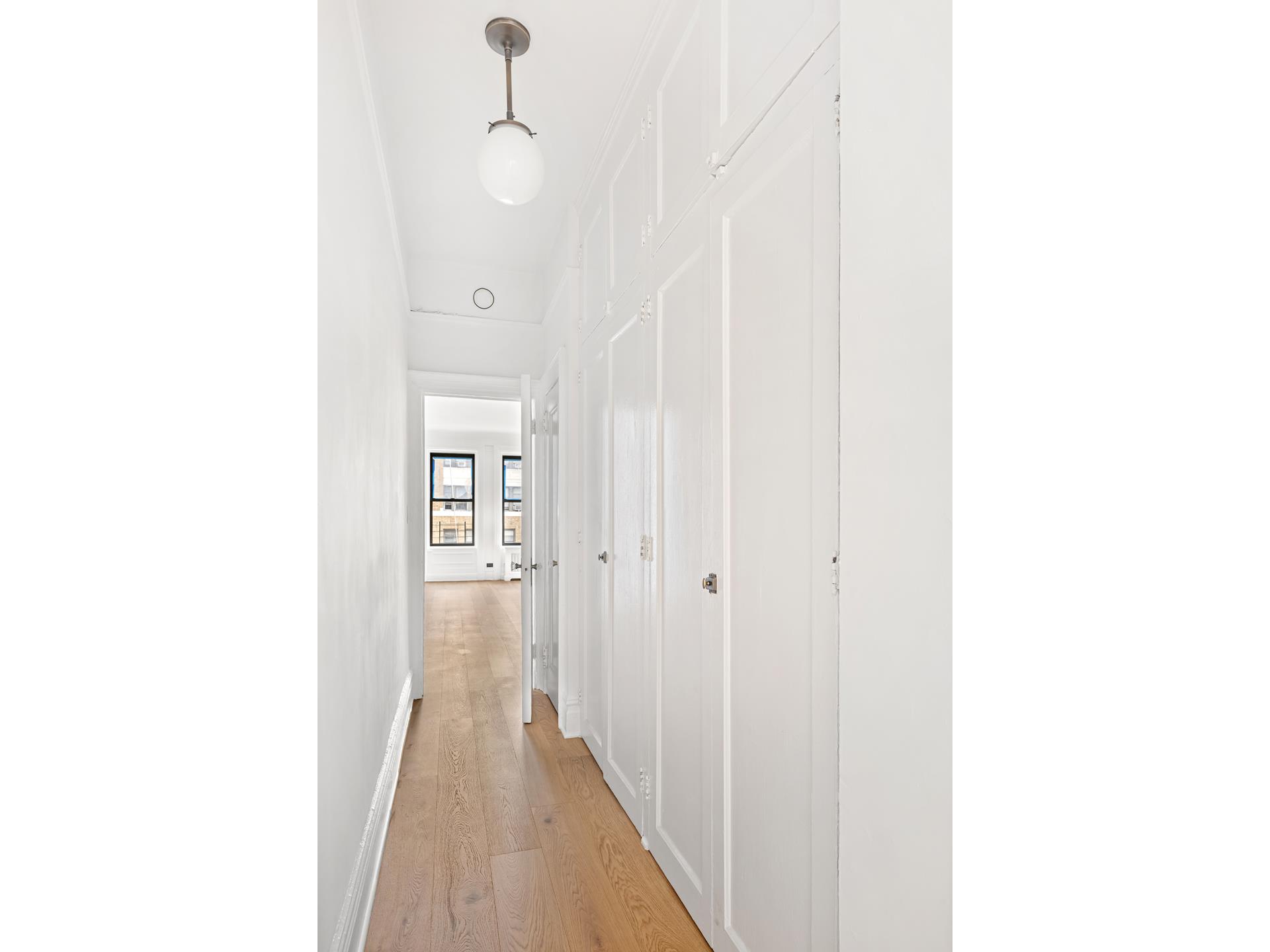 340 West 86th Street, Unit 11C Manhattan, NY 10024 - Photo 12 of 15 a view of a hallway with wooden floor