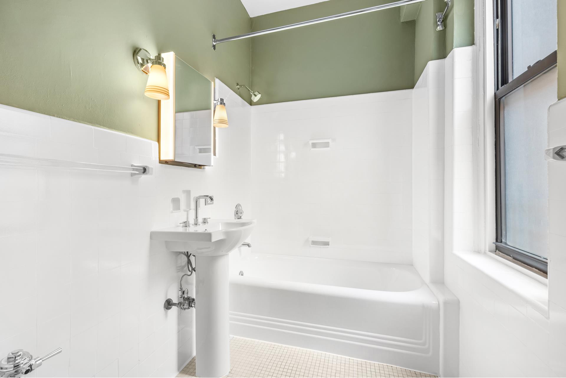 340 West 86th Street, Unit 11C Manhattan, NY 10024 - Photo 14 of 15 a bathroom with a bathtub and a sink