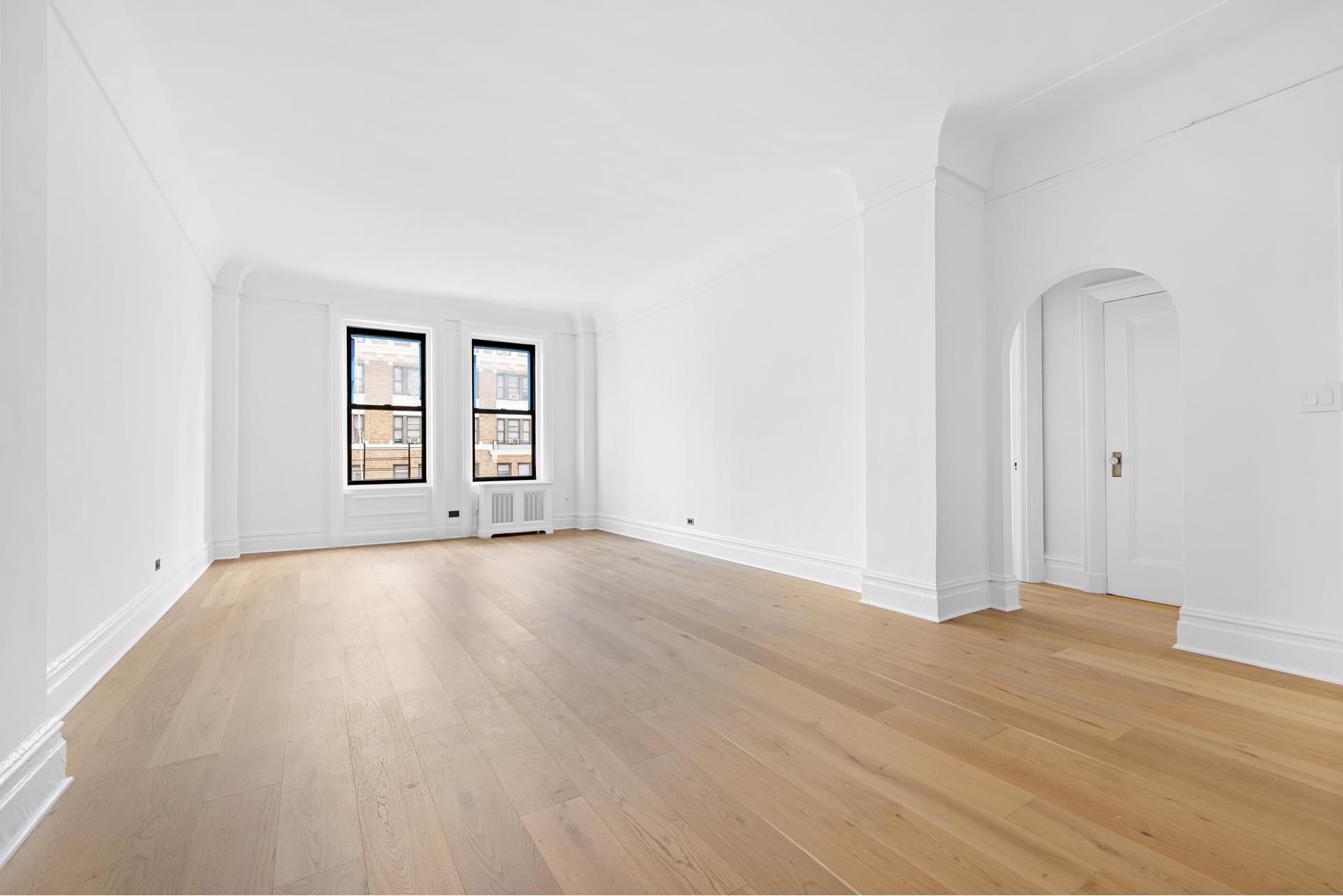 340 West 86th Street, Unit 11C Manhattan, NY 10024 - Photo 2 of 15 an empty room with windows and closet