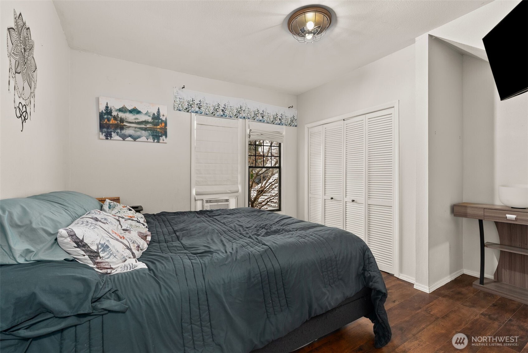 610 Barnhart Street Raymond, WA 98577 - Photo 17 of 34 a bedroom with a bed and a television