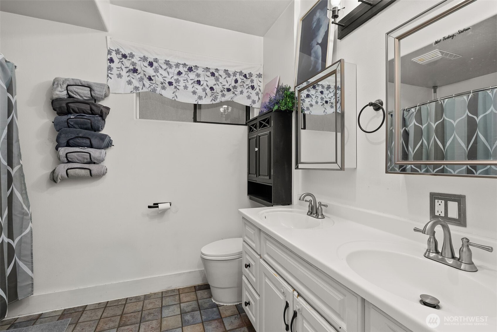 610 Barnhart Street Raymond, WA 98577 - Photo 18 of 34 a bathroom with a sink a toilet and shower curtain