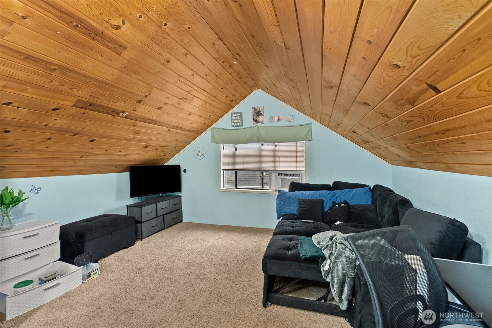 610 Barnhart Street Raymond, WA 98577 - Photo 24 of 34 a bedroom with furniture and a flat screen tv