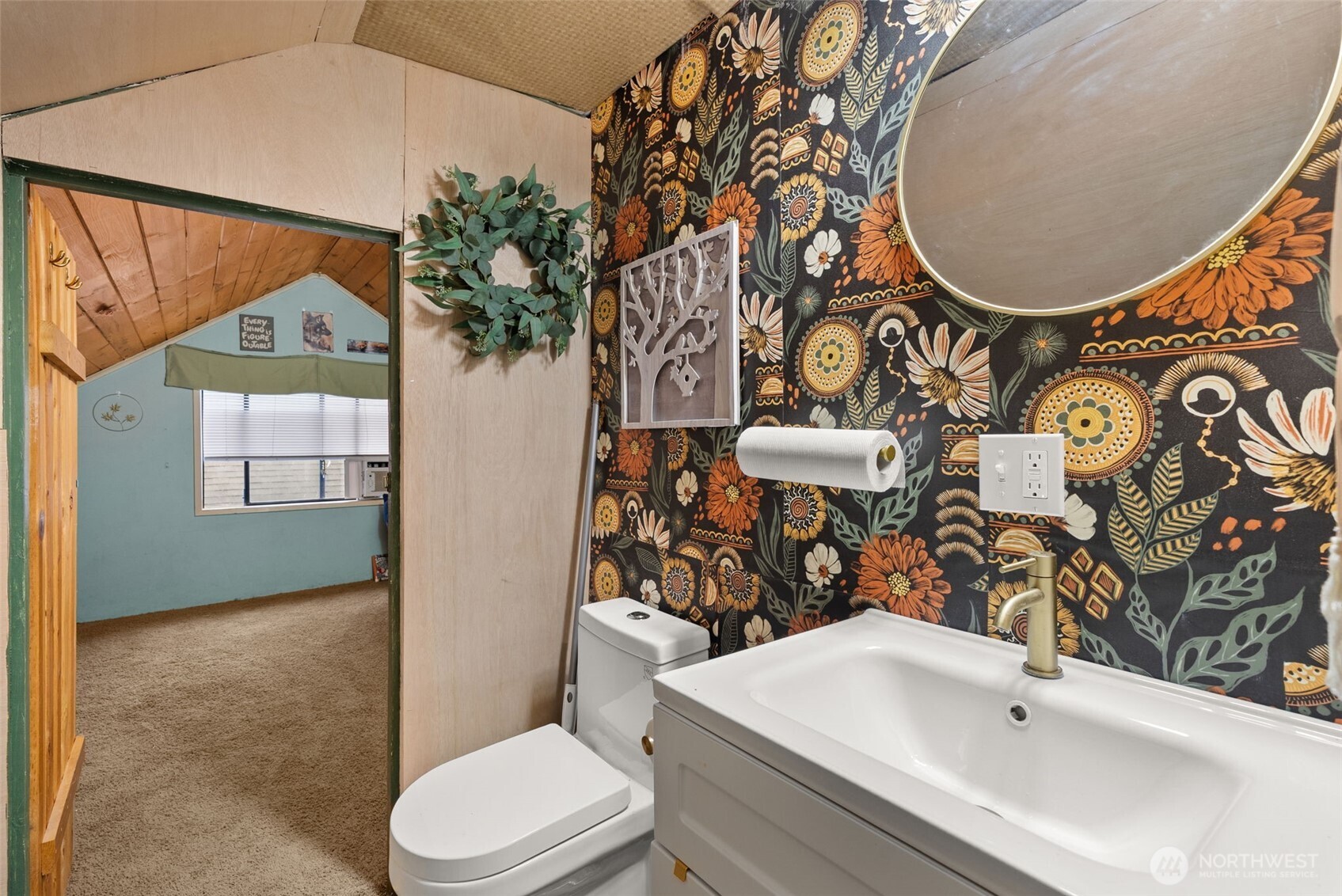 610 Barnhart Street Raymond, WA 98577 - Photo 26 of 34 a bathroom with a sink and mirror with toilet