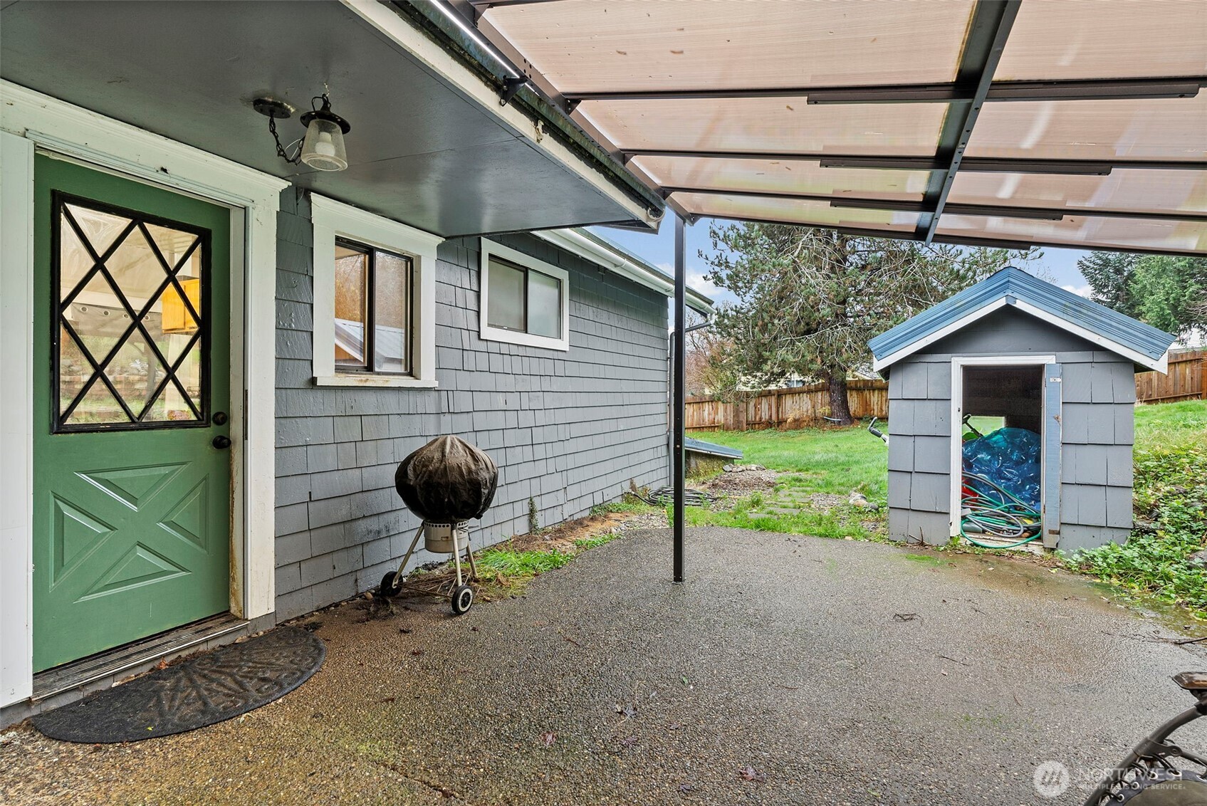 610 Barnhart Street Raymond, WA 98577 - Photo 29 of 34 a view of a backyard with table and chairs and a barbeque