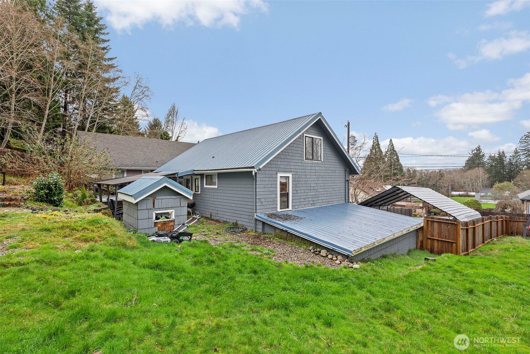 610 Barnhart Street Raymond, WA 98577 - Photo 30 of 34 a view of a house with backyard and porch