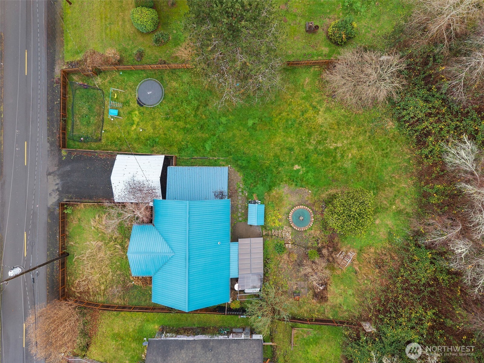 610 Barnhart Street Raymond, WA 98577 - Photo 34 of 34 an aerial view of a house with garden space and street view
