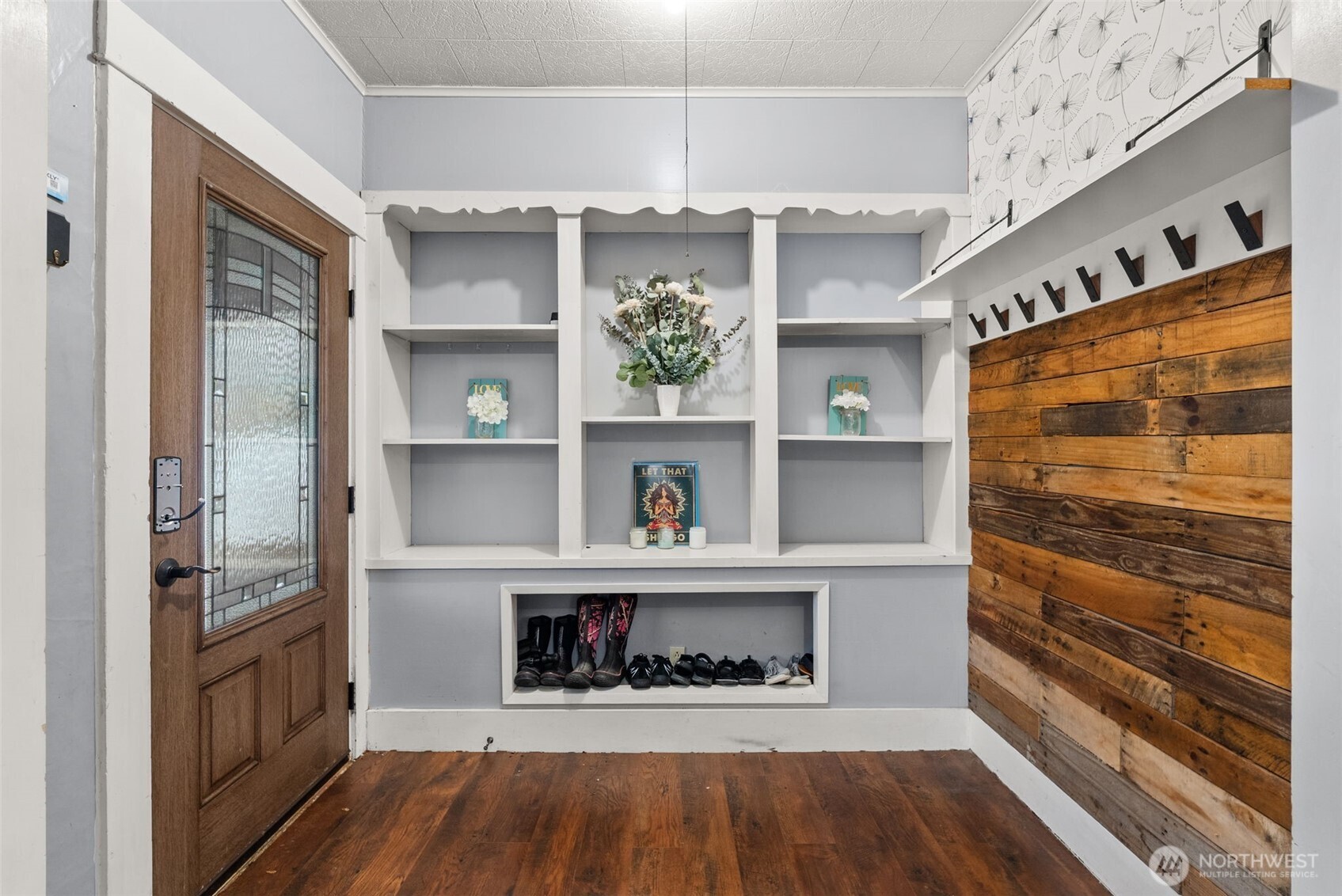 610 Barnhart Street Raymond, WA 98577 - Photo 8 of 34 a hallway with cabinets and wooden floor