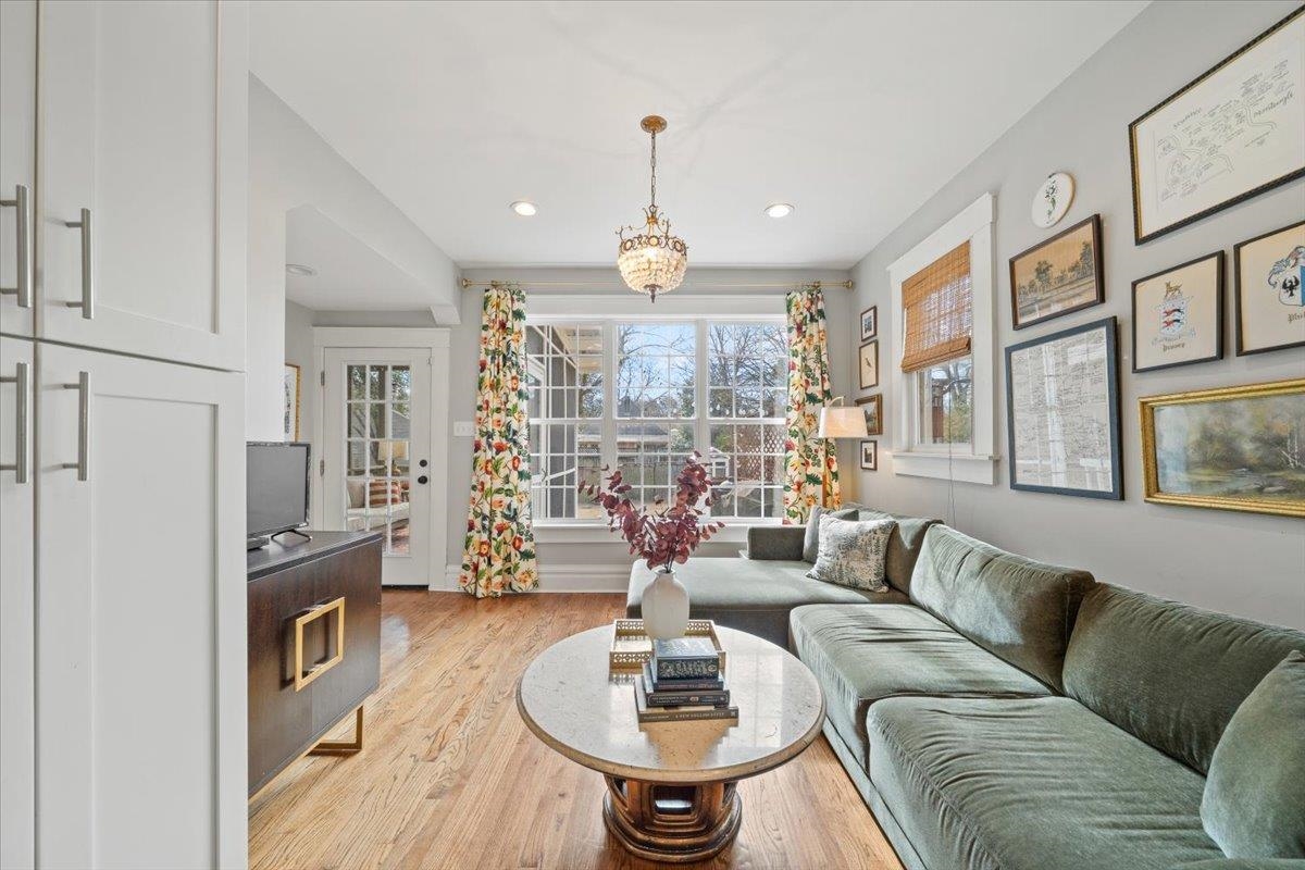 1937 Harbert Avenue Memphis, TN 38104 - Photo 12 of 32 a living room with fireplace furniture and a chandelier