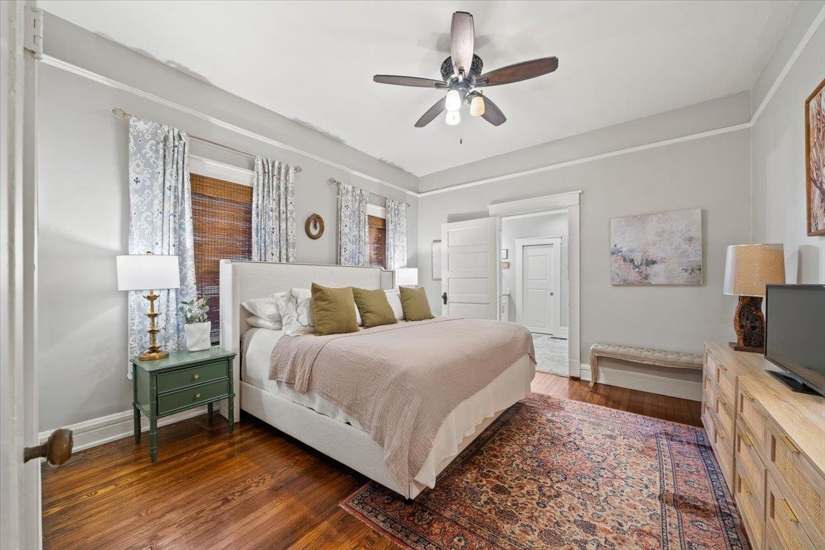 1937 Harbert Avenue Memphis, TN 38104 - Photo 16 of 32 a bedroom with a bed and a flat tv screen on dresser