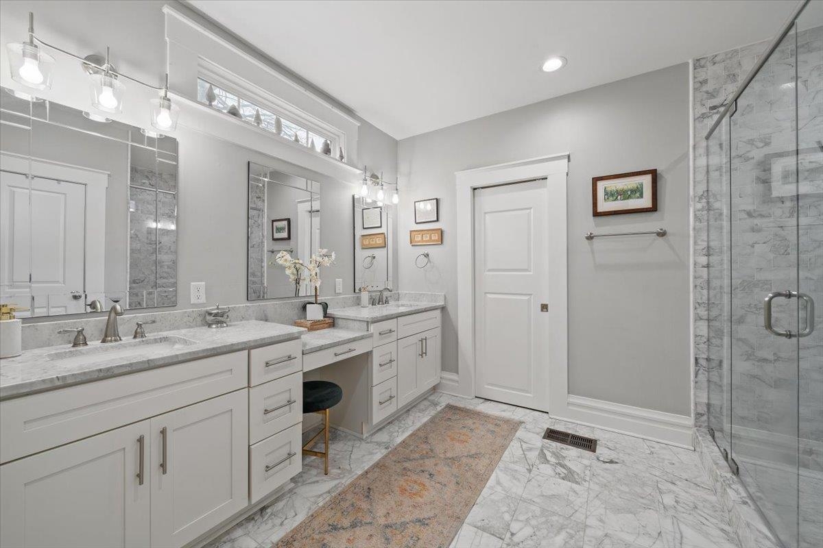 1937 Harbert Avenue Memphis, TN 38104 - Photo 17 of 32 a spacious bathroom with a granite countertop sink mirror and shower