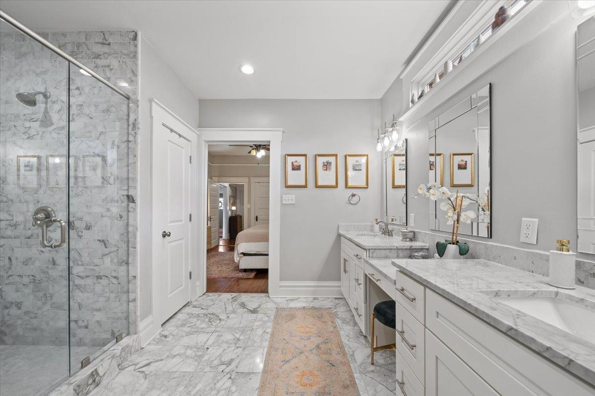 1937 Harbert Avenue Memphis, TN 38104 - Photo 18 of 32 a spacious bathroom with a granite countertop sink mirror and shower