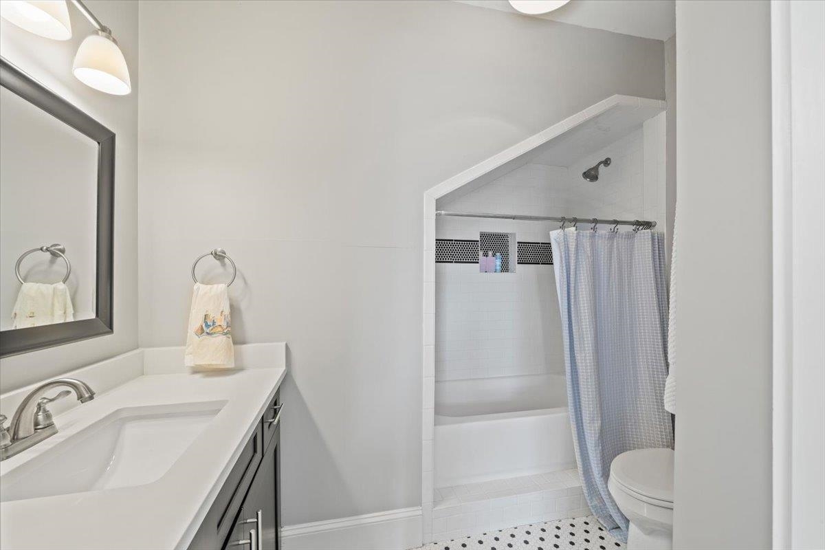 1937 Harbert Avenue Memphis, TN 38104 - Photo 23 of 32 a bathroom with a sink a toilet and shower