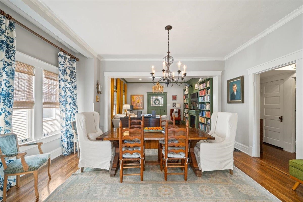 1937 Harbert Avenue Memphis, TN 38104 - Photo 8 of 32 a view of a dining room with furniture wooden floor and chandelier