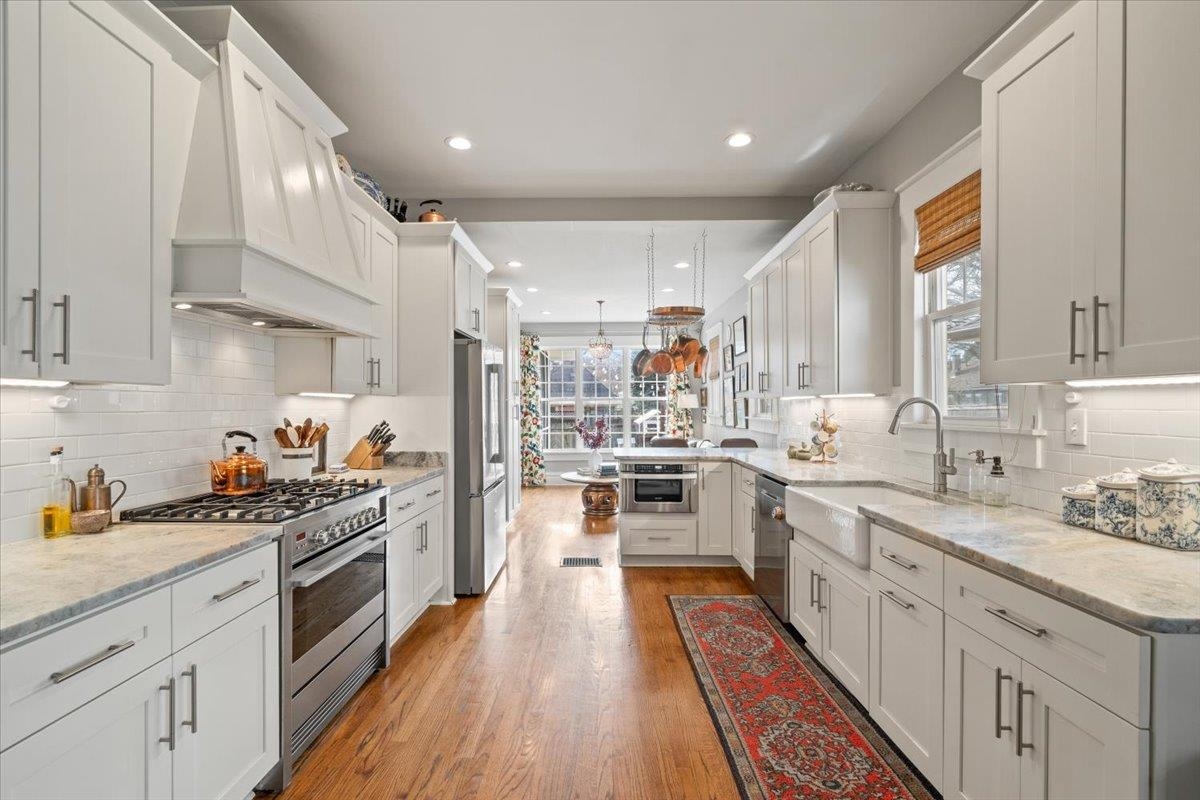 1937 Harbert Avenue Memphis, TN 38104 - Photo 9 of 32 a kitchen with stainless steel appliances a stove sink and cabinets