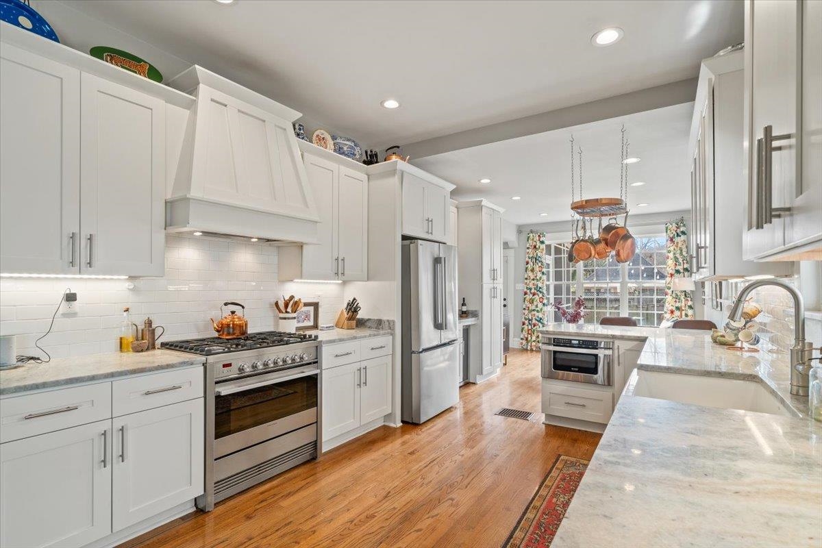 1937 Harbert Avenue Memphis, TN 38104 - Photo 10 of 32 a kitchen with granite countertop a sink stainless steel appliances and cabinets