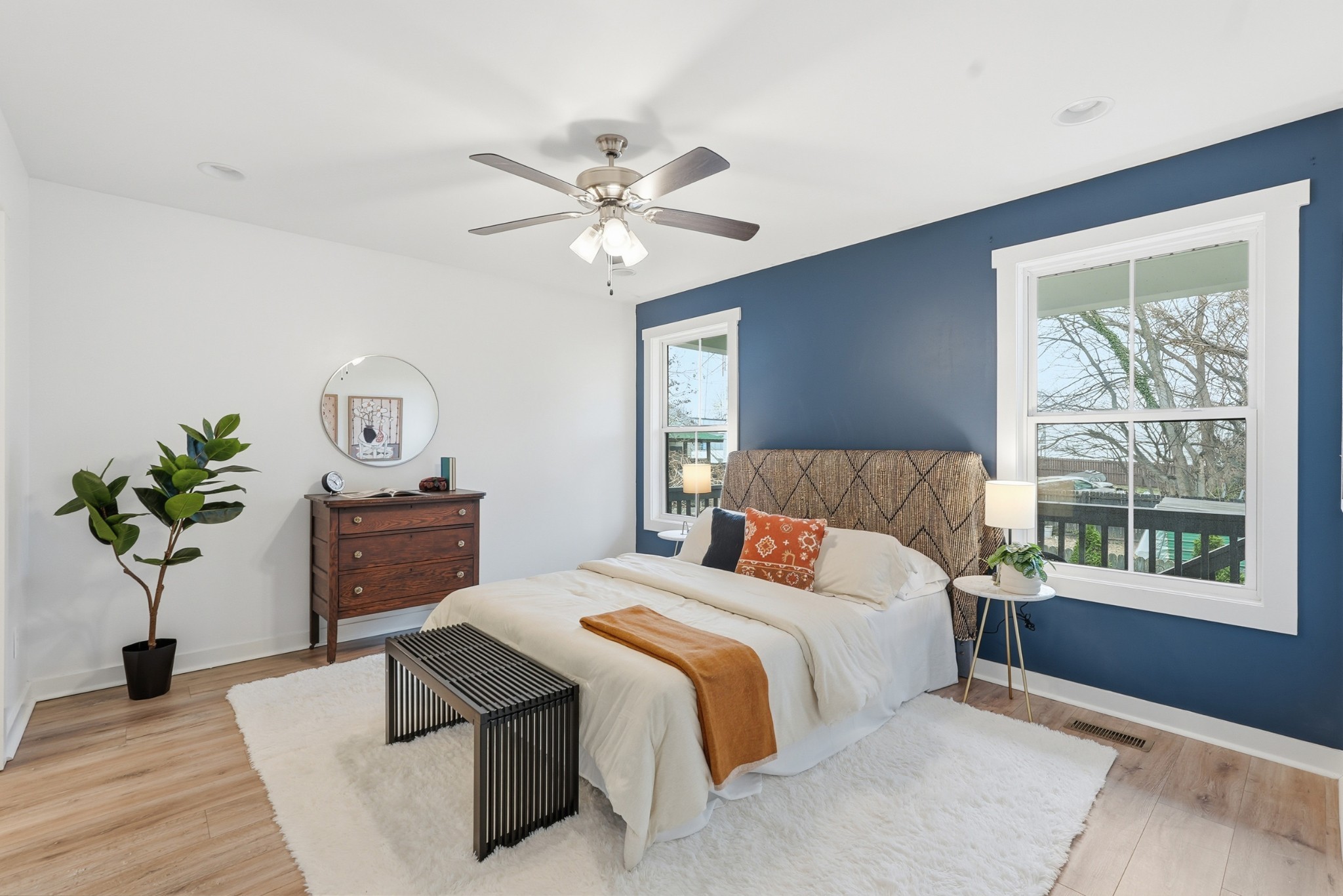 113 11th Avenue West Springfield, TN 37172 - Photo 12 of 28 a bedroom with a bed chandelier and a window