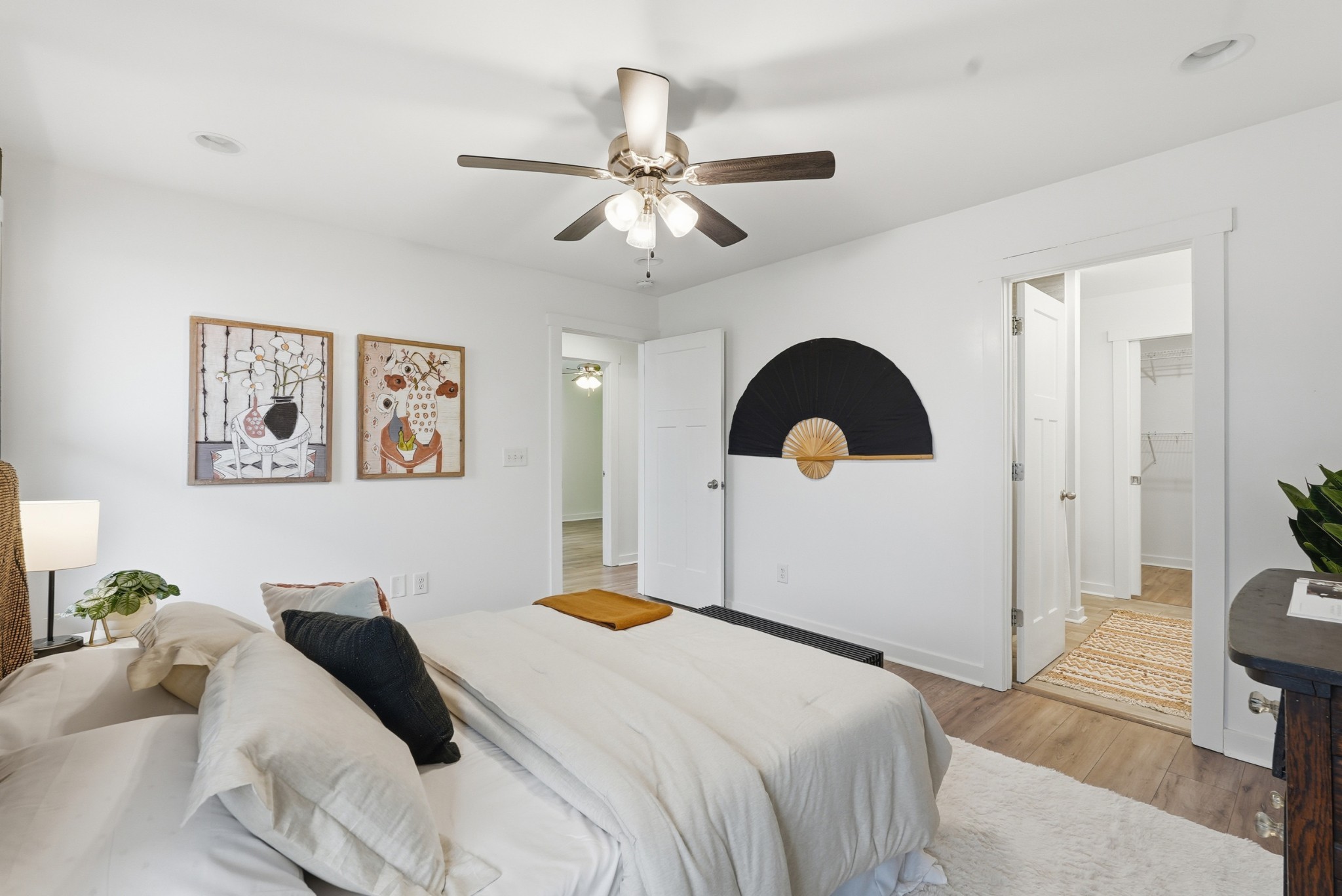 113 11th Avenue West Springfield, TN 37172 - Photo 13 of 28 a bedroom with a large bed and a chandelier