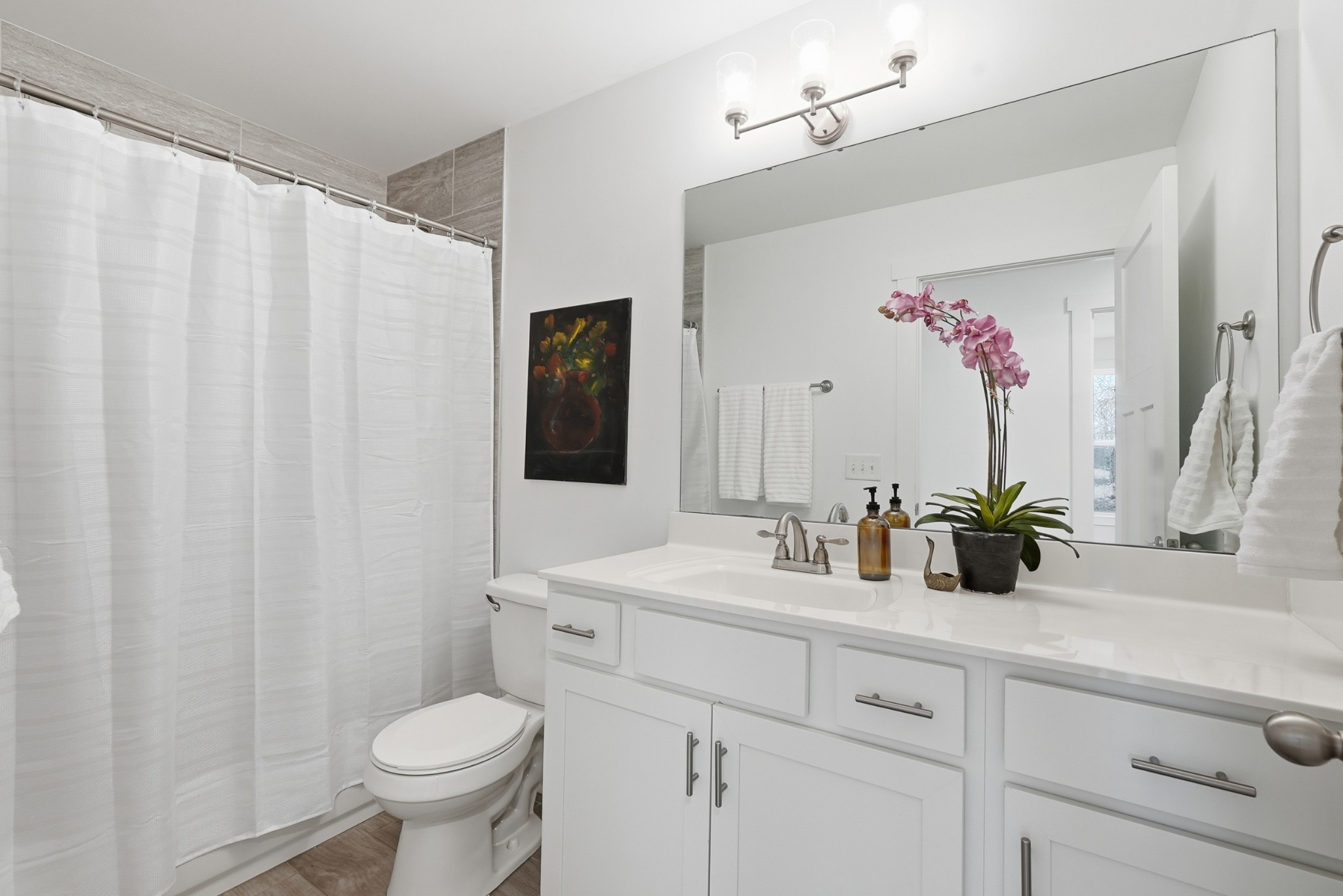 113 11th Avenue West Springfield, TN 37172 - Photo 15 of 28 a bathroom with a toilet sink and mirror