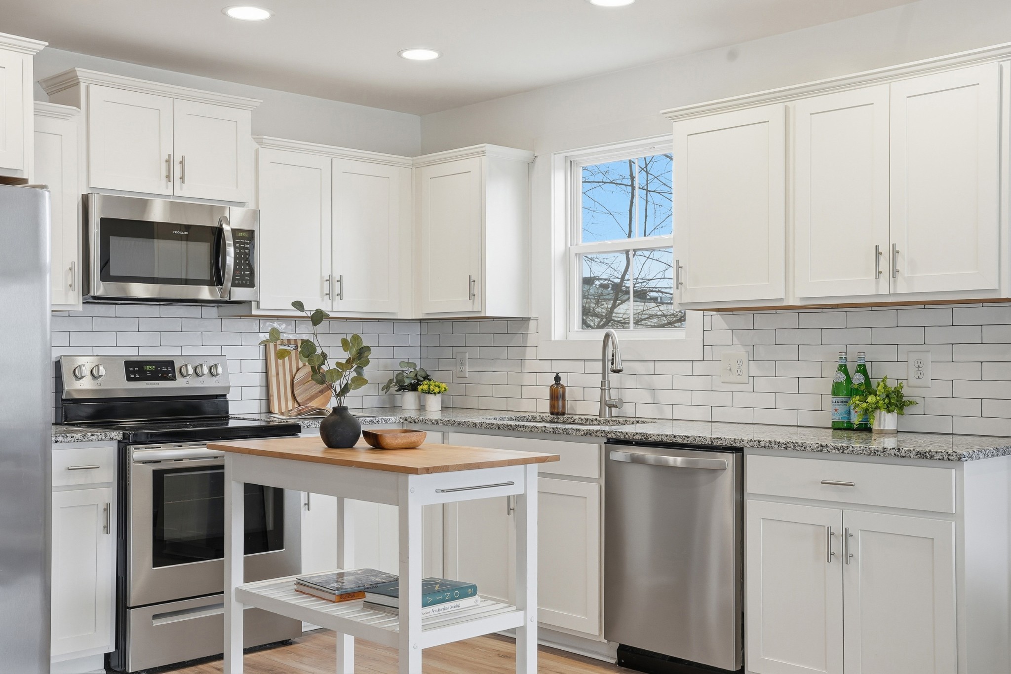 113 11th Avenue West Springfield, TN 37172 - Photo 10 of 28 a kitchen with stainless steel appliances white cabinets sink and a microwave