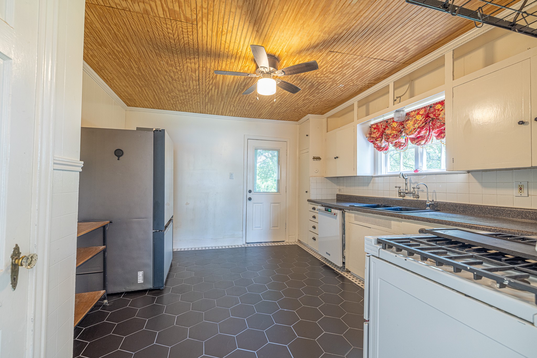 8548 Findlay Street Houston, TX 77017 - Photo 14 of 50 a kitchen with stainless steel appliances granite countertop a stove a refrigerator a sink and dishwasher