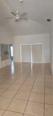 a view of an empty room and window