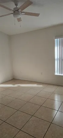 a view of an empty room and window