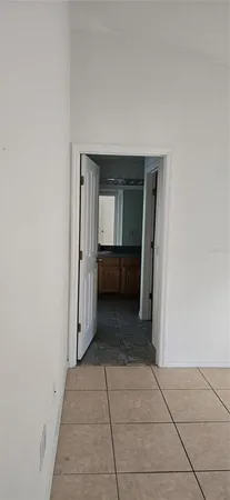 a view of a hallway to rooms
