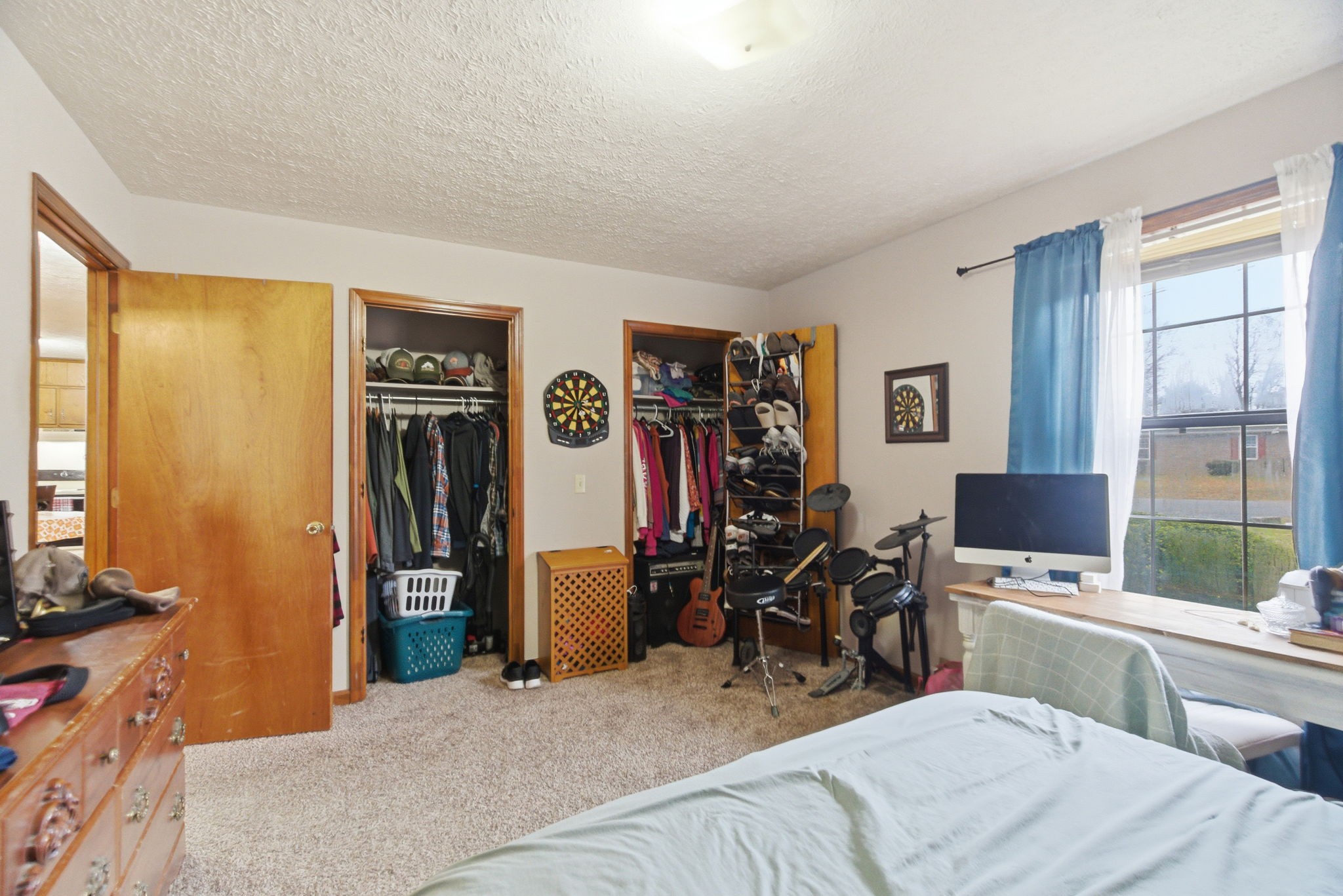 109 Gayla Court Portland, TN 37148 - Photo 21 of 48 a bedroom with a bed a computer on desk and a dresser next to a window