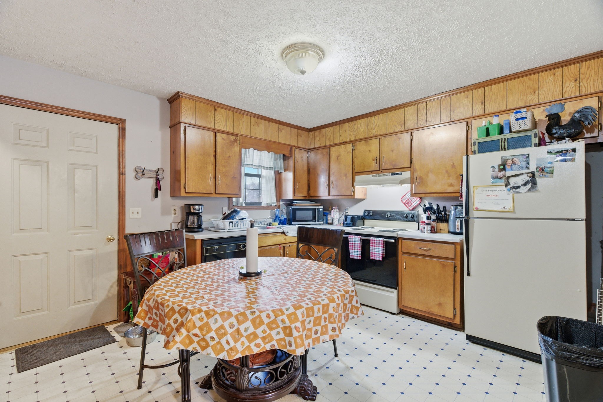 109 Gayla Court Portland, TN 37148 - Photo 10 of 48 a kitchen with stainless steel appliances granite countertop a refrigerator a sink dishwasher a stove with white cabinets and wooden floor