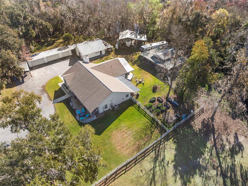 3080 Ragis Road Edgewater, FL 32132 - Photo 16 of 86 an aerial view of a house with swimming pool and outdoor space