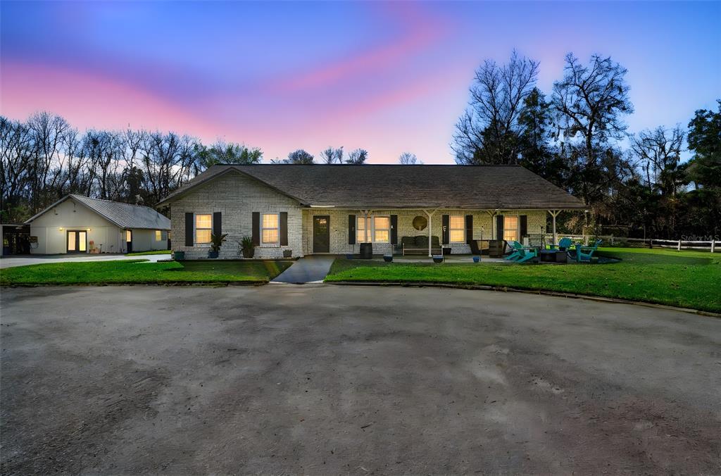 3080 Ragis Road Edgewater, FL 32132 - Photo 2 of 86 a front view of a house with a yard and trees