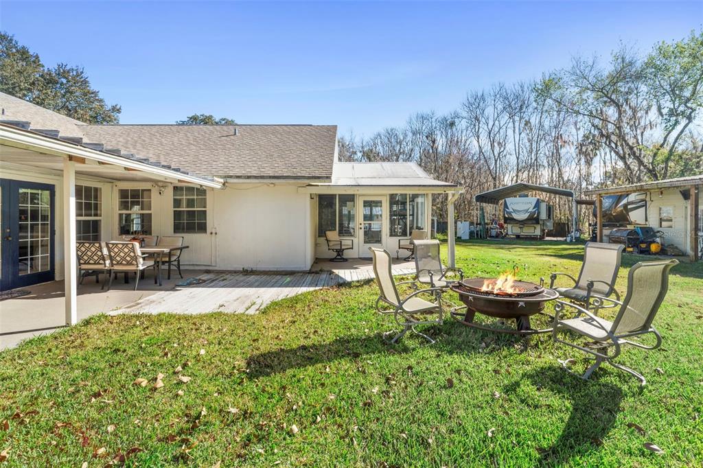 3080 Ragis Road Edgewater, FL 32132 - Photo 22 of 86 a view of a house with swimming pool and sitting area