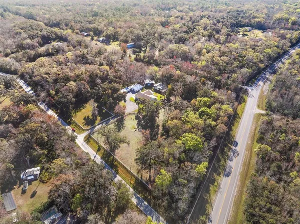a view of a dining room with furniture and window