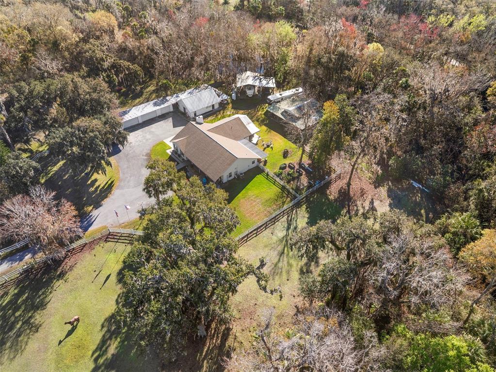 3080 Ragis Road Edgewater, FL 32132 - Photo 32 of 86 an aerial view of a house with a swimming pool