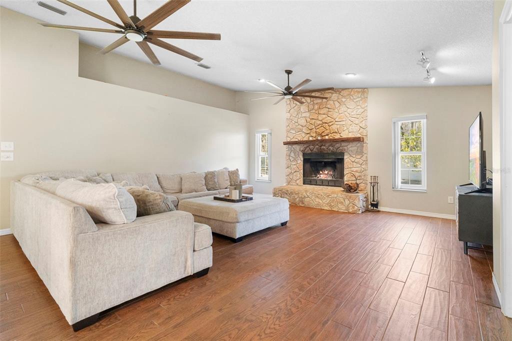 3080 Ragis Road Edgewater, FL 32132 - Photo 33 of 86 a living room with furniture and a fireplace