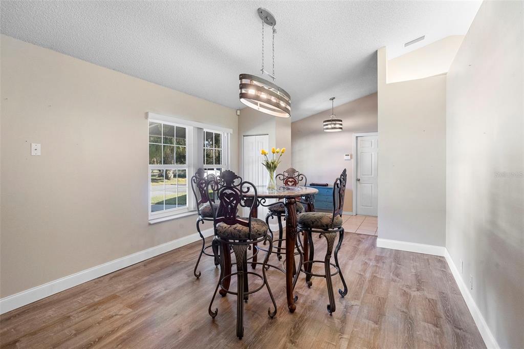 3080 Ragis Road Edgewater, FL 32132 - Photo 45 of 86 a view of a dining room with furniture and window