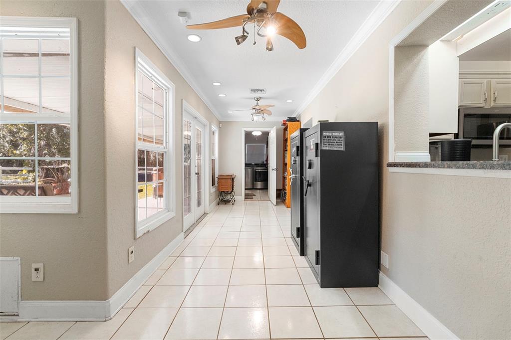 3080 Ragis Road Edgewater, FL 32132 - Photo 50 of 86 a view of a refrigerator in kitchen and a windows