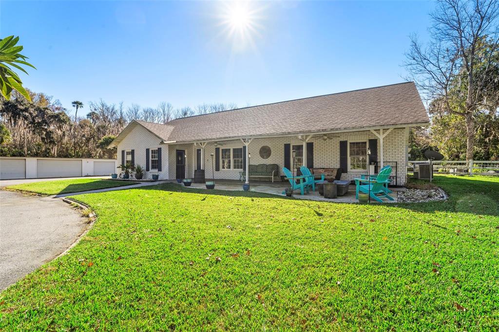 3080 Ragis Road Edgewater, FL 32132 - Photo 5 of 86 a view of a house with swimming pool and a yard