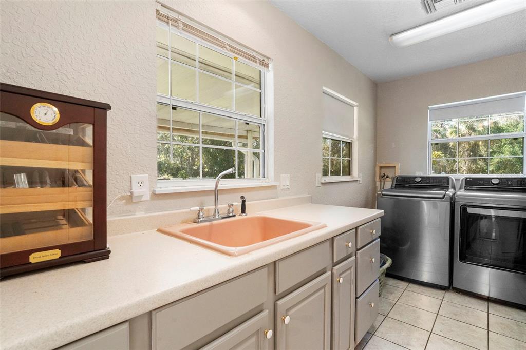 3080 Ragis Road Edgewater, FL 32132 - Photo 52 of 86 a kitchen that has a sink and a stove