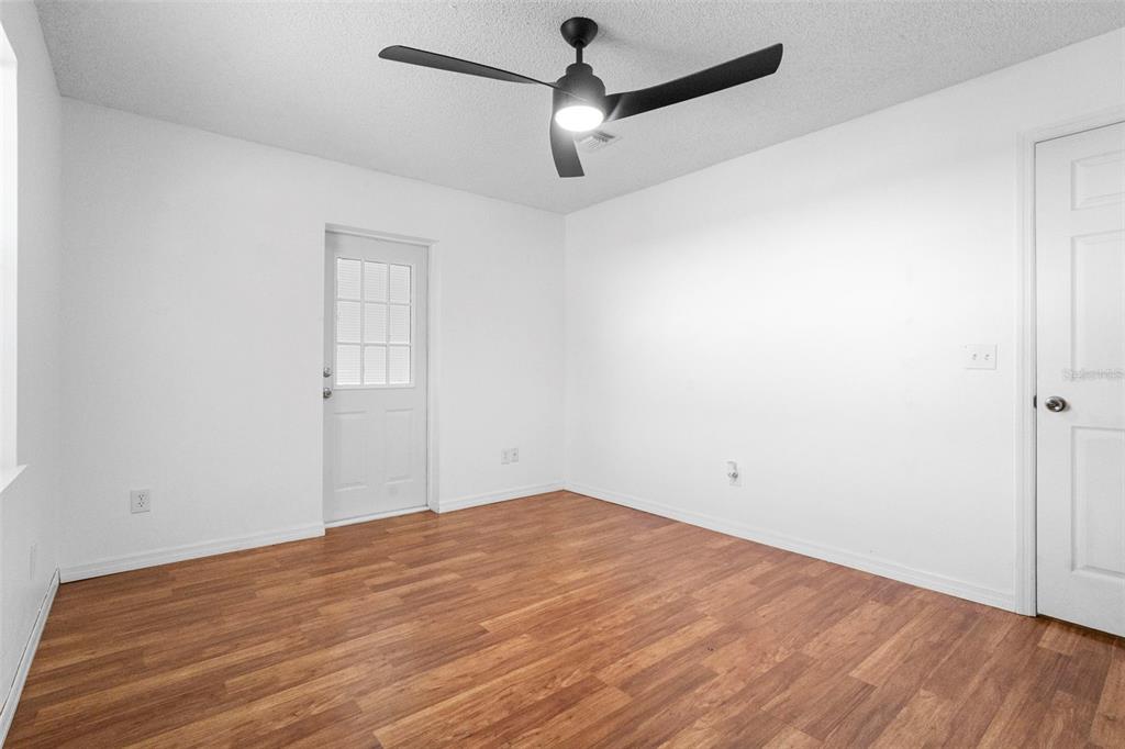3080 Ragis Road Edgewater, FL 32132 - Photo 59 of 86 a view of empty room with wooden floor