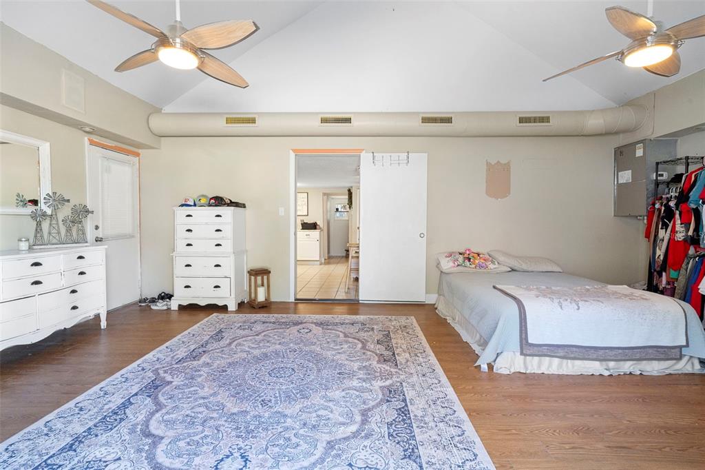 3080 Ragis Road Edgewater, FL 32132 - Photo 68 of 86 a bed room with a bed and a ceiling fan