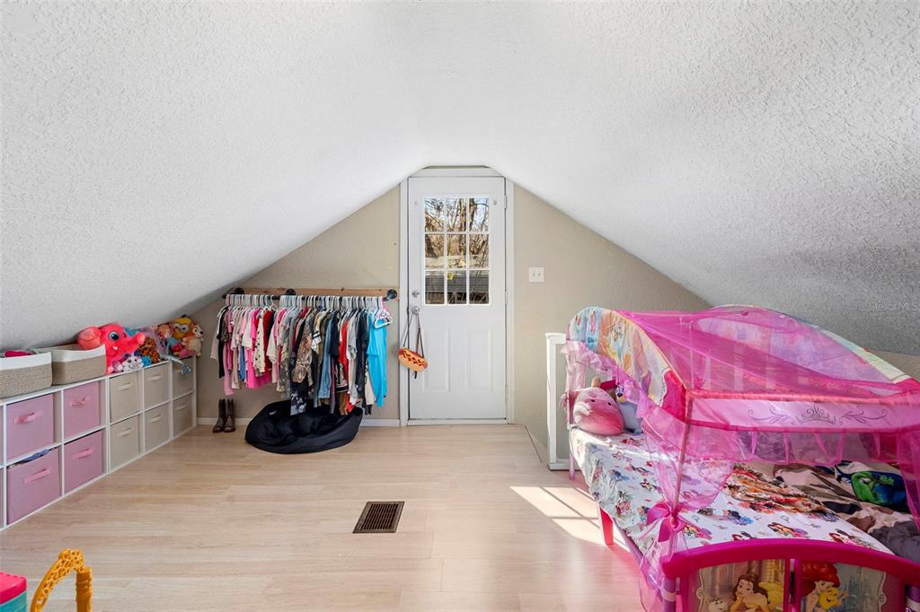 3080 Ragis Road Edgewater, FL 32132 - Photo 79 of 86 a view of walk in closet with clothes