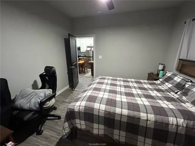 a bedroom with a bed and a mirror