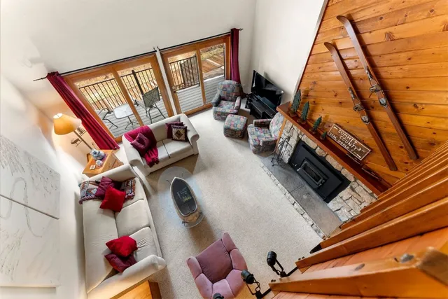 a view of living room with furniture and a rug