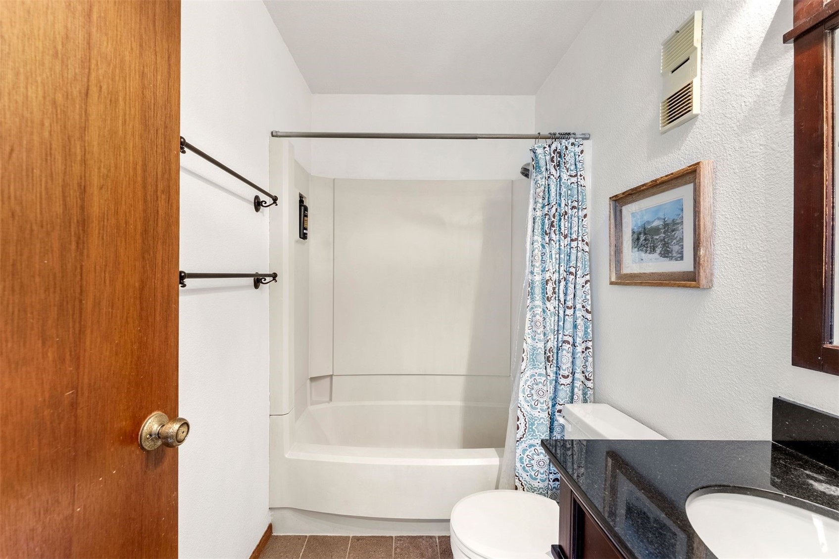 10500 Ryan Gulch Road, Unit J106 Silverthorne, CO 80498 - Photo 16 of 22 a bathroom with a sink toilet and shower