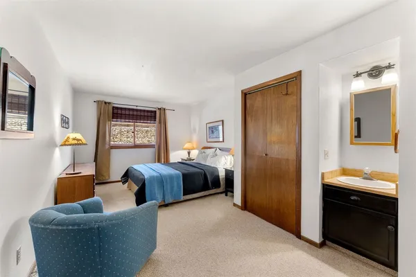 a bedroom with furniture and a window
